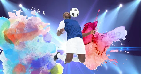 Composição Jogador Futebol Com Bola Sobre Splodges Coloridos Estádio Esportes — Fotografia de Stock