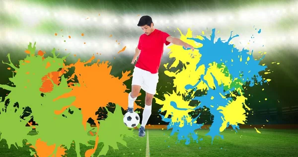 Composição Jogador Futebol Com Bola Sobre Splodges Coloridos Estádio Esportes — Fotografia de Stock