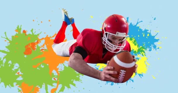 Animation Eines American Football Spielers Mit Ball Über Bunten Klecksen — Stockvideo