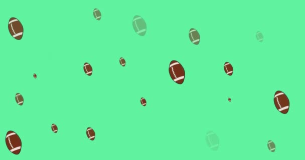 緑の背景にラグビーボールの複数の行のアニメーション スポーツと競争の概念をデジタルで生成し — ストック動画