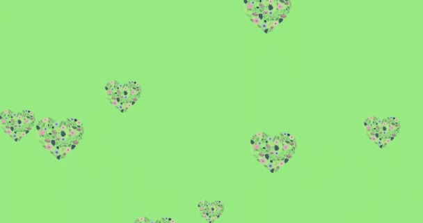 Animación Formas Corazón Llenas Flores Flotando Sobre Fondo Verde Claro — Vídeo de stock