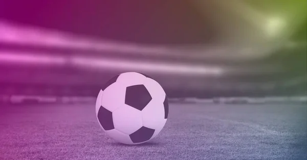 Composition of football on white line on grass pitch with copy space and pink tint. sport and competition concept digitally generated image.