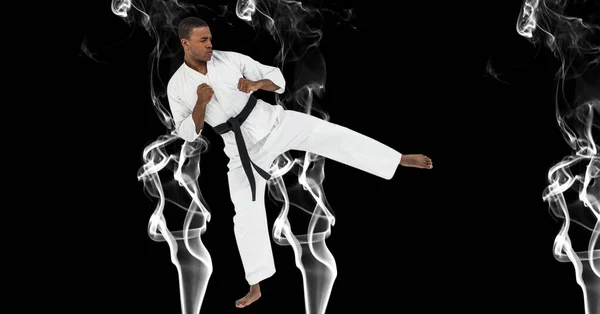 Sammansättning Manliga Kampsport Karate Artist Med Svart Bälte Sparkar Över — Stockfoto