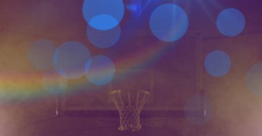 Sarı arka planda prizma bulunan mavi ışıklı basketbol sepeti kompozisyonu. Spor ve rekabet konsepti dijital olarak oluşturulmuş imaj.