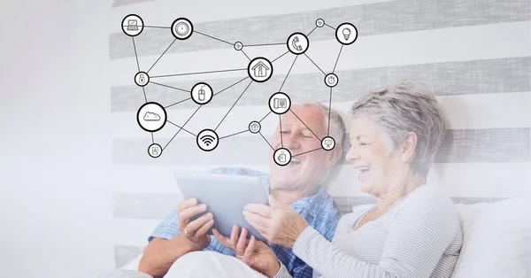 Composición Iconos Digitales Sobre Feliz Pareja Ancianos Utilizando Tableta Cama — Foto de Stock