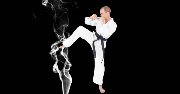 Composición Artista Karate Marcial Masculino Con Cinturón Negro Pateando Sobre — Foto de Stock