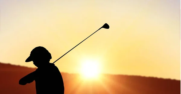 Composition of silhouette of golf player over landscape and sun setting with copy space. sport and competition concept digitally generated image.