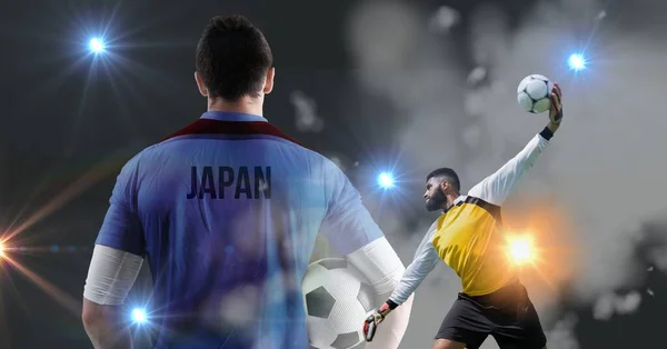 Sammansättning Japanska Fotbollsspelare Med Fotbollar Och Glödande Spotlights Idrotts Och — Stockfoto