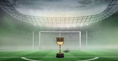 Futbol sahasında ve stadyumda altın kupa ve futbol kompozisyonu. şampiyonluklar, spor ve yarışma konsepti dijital olarak oluşturulmuş imaj.