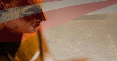 Amerikan bayrağı üzerinde hareket eden Buda figürünün animasyonu. Amerikan vatanseverliği ve din konsepti dijital olarak oluşturulmuş imaj.