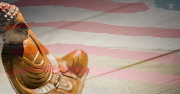 在美国国旗上飘扬的佛像的动画 美国爱国主义和宗教概念数字生成的图像 — 图库视频影像