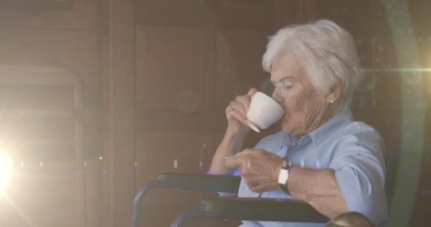 Animation Glowing Light Serious Senior Woman Drinking Tea Retirement Happy — Stock Video