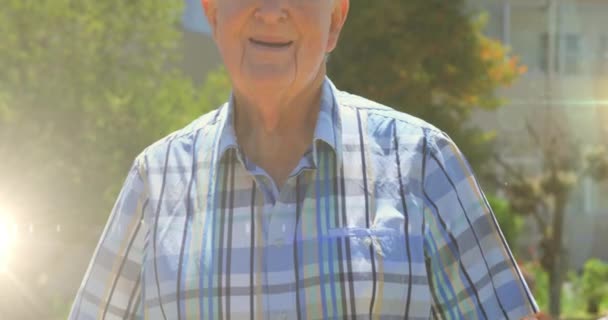 Animation Glowing Lights Smiling Senior Man Trees Background Retirement Senior — Stock Video