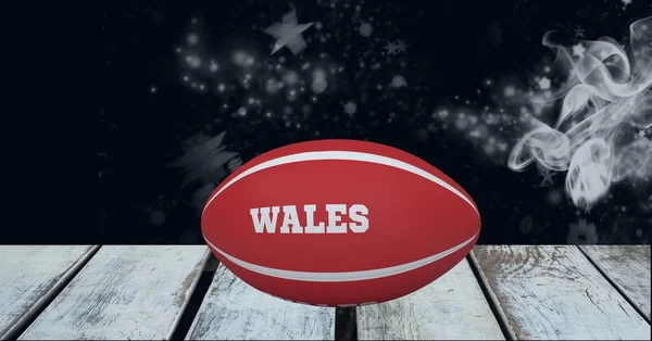 Rød Rugbykugle Med Wales Tekst Træoverflade Mod Røg Effekt Sort - Stock-foto