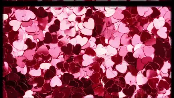 赤とピンクの心の上に白い円と滑りフィルムフレームのアニメーション バレンタインデー愛と恋愛の概念をデジタルで生成したビデオ — ストック動画