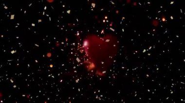 Siyah arka planda pembe kalplerle yere düşen konfeti animasyonu. Sevgililer Günü, aşk ve romantizm konsepti dijital olarak oluşturulmuş video.