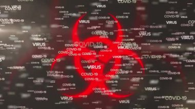 Animation of covid 19 text over biohazard symbol. global covid 19 pandemic concept digitally generated video.