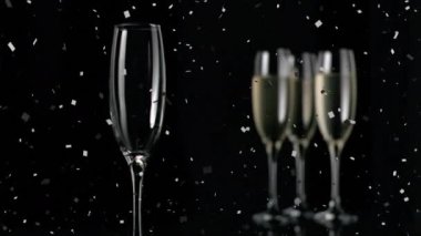 Şampanya kadehleri ve şampanyaların canlandırılması, konfetilerin siyah arka plana düşmesi. kutlama ve parti konsepti, dijital olarak oluşturulmuş video.