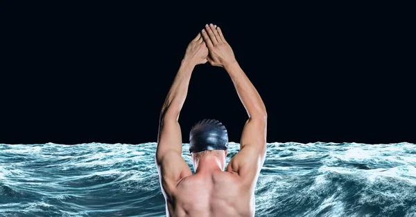 Composition of male swimmer jumping into water on black background. sport and competition concept digitally generated image.