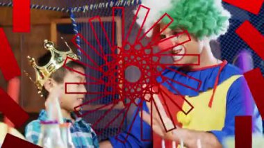 Kırmızı halkalar palyaço ve çocuğun partide eğlenmesi üzerine. çocukluk, parti ve kutlama konsepti dijital olarak oluşturulmuş video.