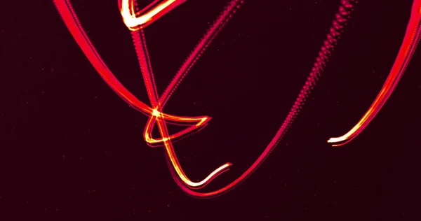 Две Светящиеся Красные Линии Движутся Черном Фоне Энергия Электричество Цвет — стоковое фото
