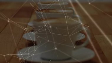 Kahve fincanlarıyla bağlantı ağının animasyonu. küresel bağlantılar, dijital arayüz, teknoloji ve ağ konsepti dijital olarak oluşturulmuş video.