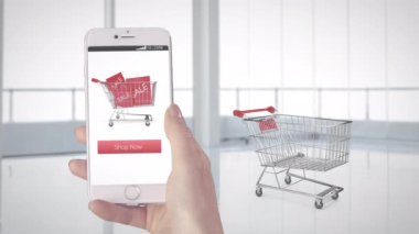 Alışveriş uygulaması kullanarak, alışveriş arabasına konan kutuların üzerinde akıllı telefonu tutmanın animasyonu. Çevrimiçi alışveriş ve küresel iletişim teknolojisi kavramı, dijital olarak üretilen video.
