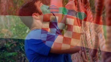 Bayrak animasyonu, güçlü kaslı adamın barfiks çekmesi üzerine Hırvat oldu. global spor, fitness ve egzersiz konsepti dijital olarak oluşturulmuş video.