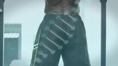 Sporcu üzerinde dönen DNA ipliği ve veri işleme ile dijital arayüzün animasyonu. Tıbbi araştırma teknolojisi ve spor konsepti dijital olarak üretilen animasyon.