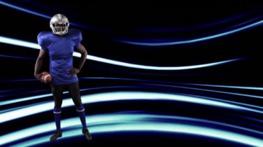 Işık yollarında top oynayan Amerikan futbolcusunun animasyonu. global spor, fitness ve veri işleme konsepti dijital olarak oluşturulmuş video.
