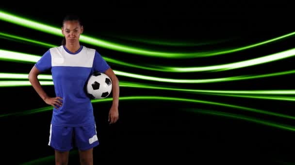 Jogador Futebol Segurando Bola Sobre Trilhas Luz Conceito Global Esportes — Vídeo de Stock