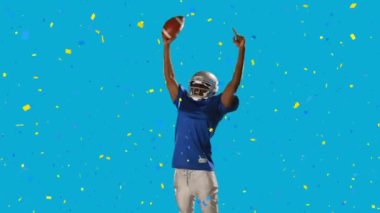 Amerikan futbolcusunun üzerine düşen konfeti animasyonu. Top mavi arka planda. Spor ve yarışma konsepti dijital olarak oluşturulmuş video.