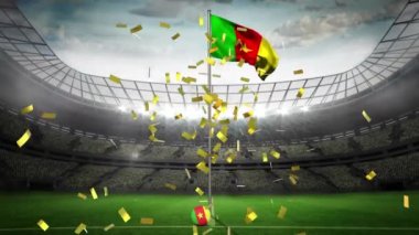 Spor stadyumunda kamerun bayrağından düşen altın konfetilerin canlandırması. spor, zafer, başarı, rekabet ve kutlama konsepti, dijital olarak oluşturulmuş video.