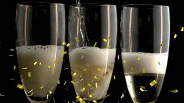 Şampanya kadehlerinin üzerine düşen altın konfetilerin animasyonu. Yeni yıl partisi ve kutlama konsepti dijital olarak oluşturulmuş video.
