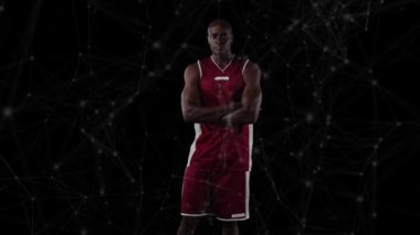 Siyah arka planda basketbol oyuncusu üzerinden bağlantı ağının animasyonu. global spor, rekabet ve bağlantılar dijital olarak oluşturulmuş video konsepti.
