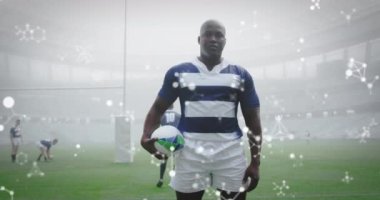 Stadyumdaki erkek rugby oyuncuları üzerinde kimyasal yapıların animasyonu. spor ve yarışma konsepti dijital olarak oluşturulmuş video.