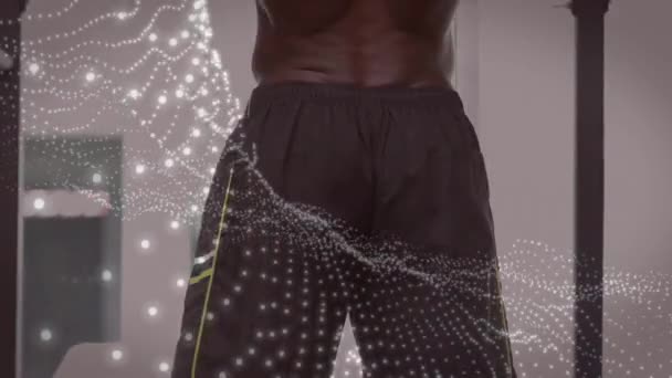 Animacja Świecących Plamek Nad Silnym Mężczyzną Ćwiczącym Siłowni Sport Fitness — Wideo stockowe