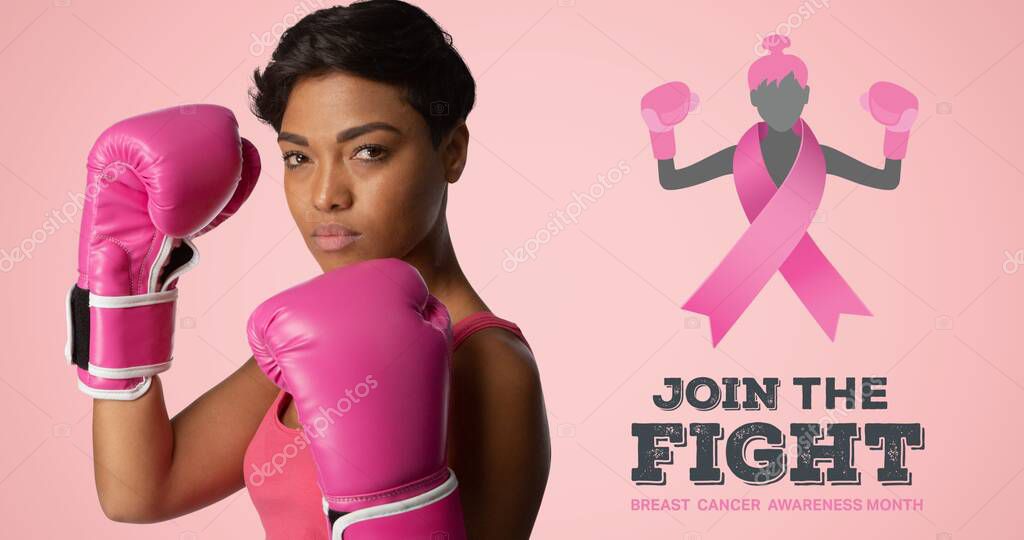 Composition of pink ribbon logo and breast cancer text, with woman wearing boxing gloves. breast cancer positive awareness campaign concept digitally generated image.
