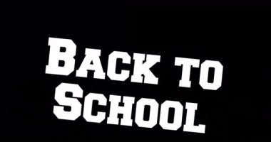 Siyah arkaplan üzerine okula dönüş metninin animasyonu. okul, eğitim ve öğrenim konsepti dijital olarak oluşturulmuş video.