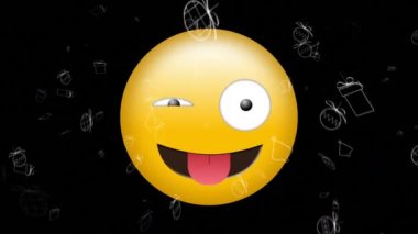 Animation of happy emoji icon over moving christmas icons on black background. global social media and communication concept digitally generated video.