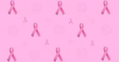 Pembe arka planda parlayan çoklu pembe kurdele logosu ve göğüs kanseri metninin animasyonu. Göğüs kanseri pozitif farkındalık kampanyası konsepti dijital olarak üretildi.