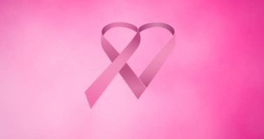 Pembe arka planda birden fazla pembe kurdele logosu görünüyor. Göğüs kanseri pozitif farkındalık kampanyası konsepti dijital olarak üretildi.