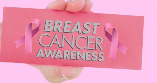 粉红丝带标志的动画与乳腺癌文字粉红背景 乳腺癌认识运动概念数字化生成的视频 — 图库视频影像