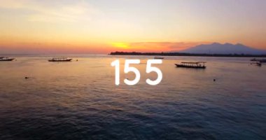 Digital composition of increasing numbers against view of the ocean. social media networking and technology concept