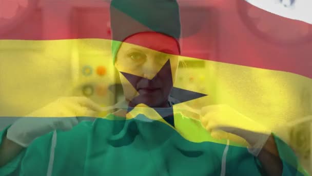 Digital Composition Ghana Flag Waving Female Surgeon Wearing Face Mask — Stock Video