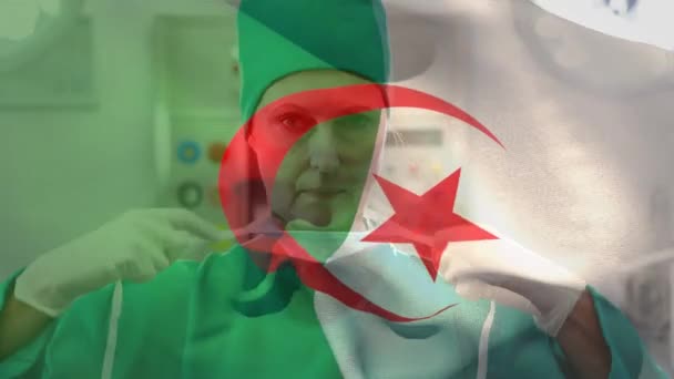 Algeria Flag Waving Senior Female Surgeon Wearing Face Mask Hospital — Stock video