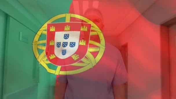 Portugal Flag Waving Caucasian Senior Male Health Worker Wearing Surgical — Vídeo de Stock