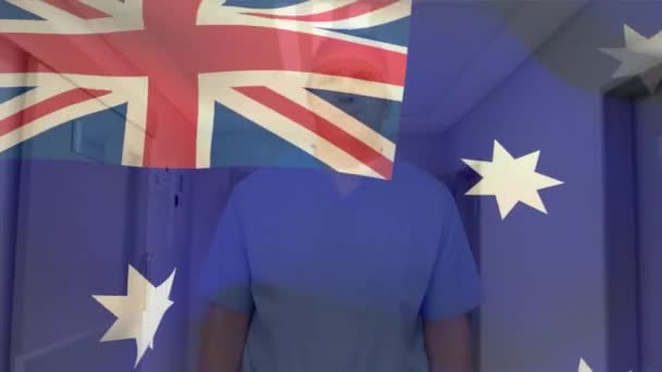 Australia Flag Waving Caucasian Senior Male Health Worker Wearing Surgical — Wideo stockowe