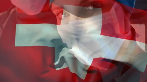 Digitale Samenstelling Van Zwitserland Vlag Zwaaien Vrouwelijke Chirurg Dragen Gezichtsmasker — Stockvideo