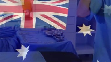 Avustralya bayrağı, hastanede yüz maskesi takan beyaz kadın sağlık görevlisine karşı dalgalanıyor. Sağlık ve Tıp Konsepti.